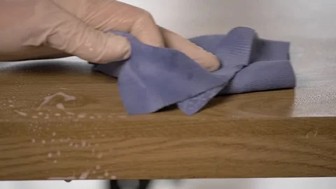 Disinfect the table surface - slow motion Stock Footage 125522270