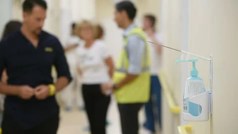 Disinfectant soap dispenser on a wall inside a new hospital Видео 250170025
