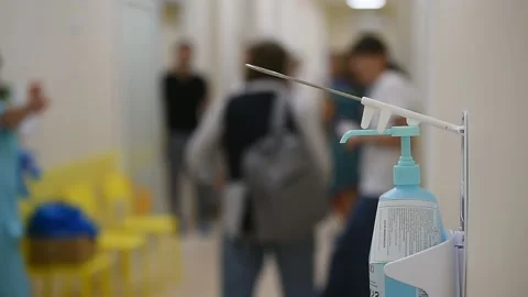 Disinfectant soap dispenser on a wall inside a new hospital Видео 250170031