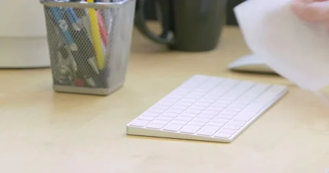 Disinfecting Computer Keyboard 4K 29.97 FPS Stock Footage 130866302