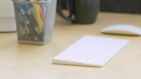 Disinfecting Computer Keyboard HD 29.97 Slomo Stock Footage 130868127