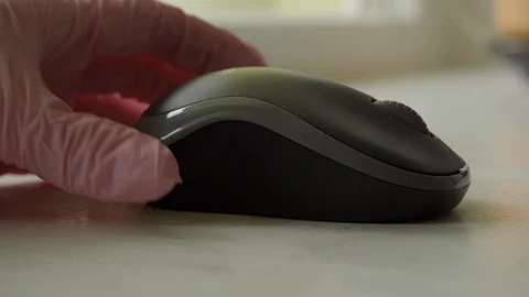 Disinfecting computer mouse with wet wipe Stock Footage 127576154