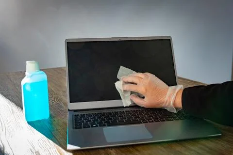 Disinfecting a notebook Stock Photos