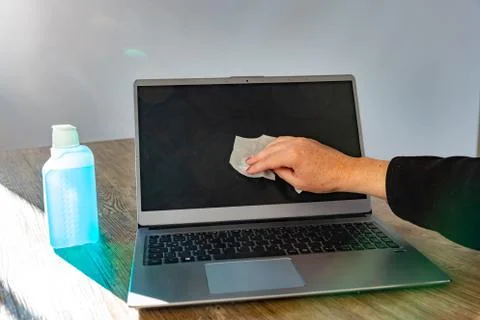 Disinfecting a notebook Stock Photos