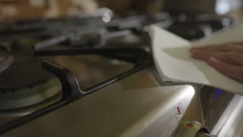 Disinfecting stove top knobs with an antibacterial wipe. Stock Footage 142031835
