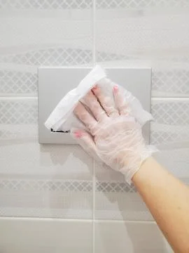Disinfection of common areas, the button will drain the water in the toilet Stock Photos