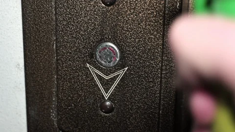 Disinfection of an elevator call button Stock Footage 128587187