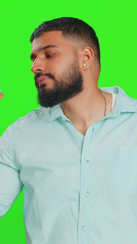 Disinterested tired Indian man having annoyed boring talk on smartphone online Stock Footage 333459000