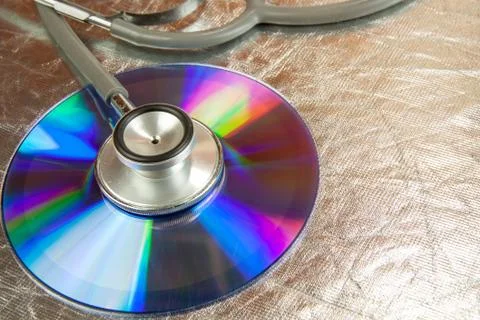 Disk CD and stethoscope Stock Photos