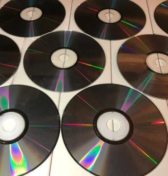 Disk dispersion refraction reflection of light colors texture on white backgr Stock Photos