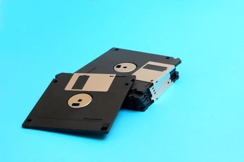 Disk floppy magnetic computer data storage support on a blue bac 写真素材