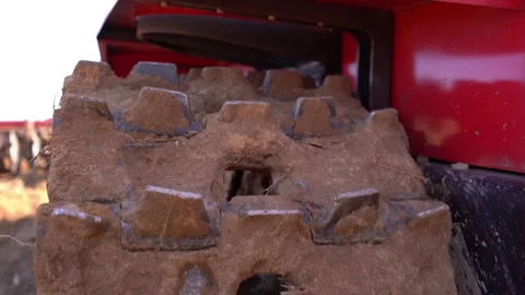 Disk harrow plowing a field in early spring, the land is cut, a plowed field for Stock Footage 156076573