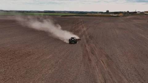 Disk harrow on plowing field. Soil cultivation field use tractor. Видео 211438959