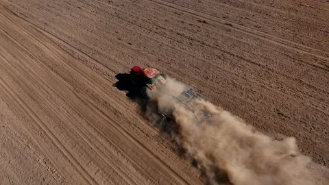Disk harrow on plowing field. Soil cultivation field use tractor. Video stock 211440063