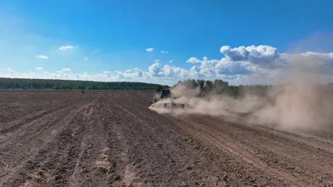 Disk harrow on plowing field. Soil cultivation field use tractor. Видео 211444528