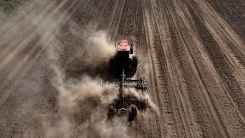 Disk harrow on plowing field. Soil cultivation field use tractor. Видео 211896473