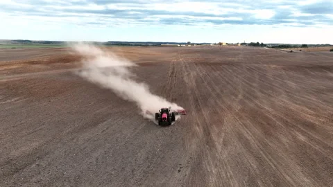 Disk harrow on plowing field. Soil cultivation field use tractor. Stock-Footage 212042102