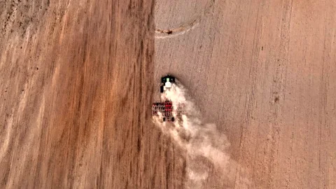 Disk harrow on plowing field. Soil cultivation field use tractor. Stock Footage 212057801