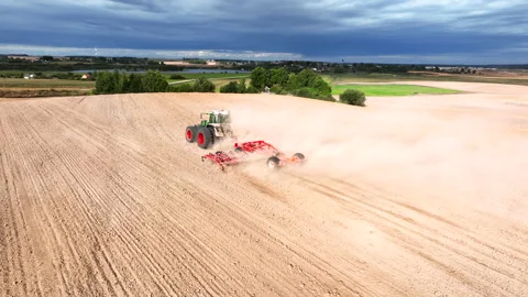 Disk harrow on plowing field. Soil cultivation field use tractor. 스톡 동영상 212062434