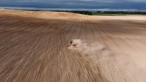 Disk harrow on plowing field. Soil cultivation field use tractor. Видео 212069224