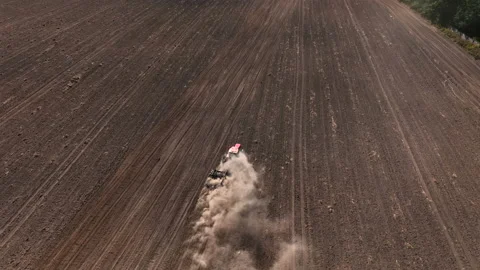 Disk harrow on plowing field. Soil cultivation field use tractor. Видео 212071621