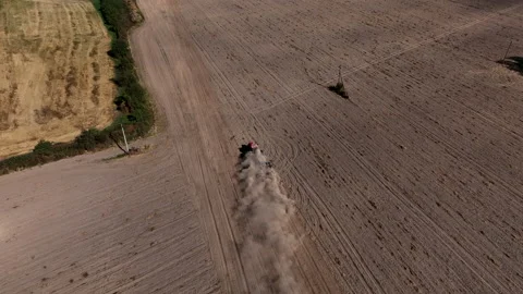 Disk harrow on plowing field. Soil cultivation field use tractor. Stock Footage 212073198