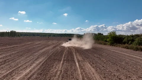 Disk harrow on plowing field. Soil cultivation field use tractor. Stock Footage 212075599