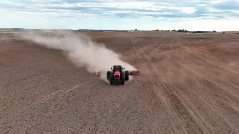 Disk harrow on plowing field. Soil cultivation field use tractor. 스톡 동영상 212101114
