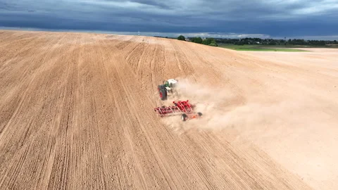 Disk harrow on plowing field. Soil cultivation field use tractor. Stock-Footage 212102598