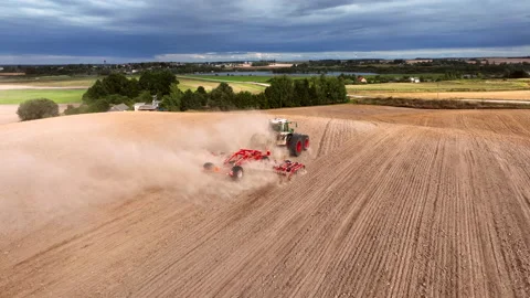Disk harrow on plowing field. Soil cultivation field use tractor. Stock Footage 212115088
