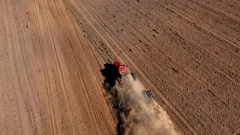 Disk harrow on plowing field. Soil cultivation field use tractor. Stock-Footage 212118010