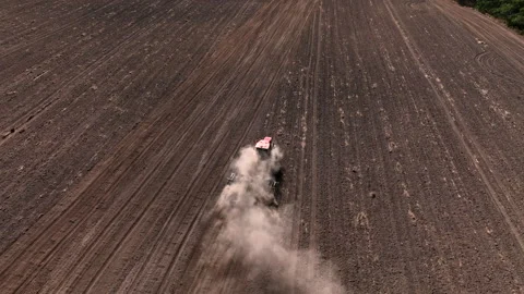 Disk harrow on plowing field. Soil cultivation field use tractor. 動画素材 212132555