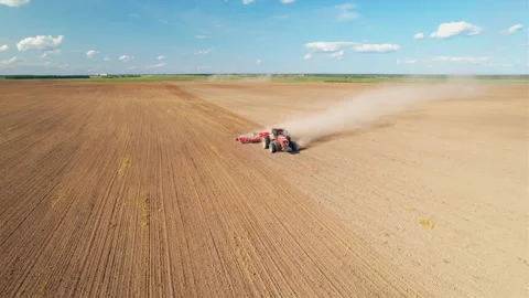 Disk harrow on plowing field. Soil cultivation field use tractor. Stock-Footage 212574420
