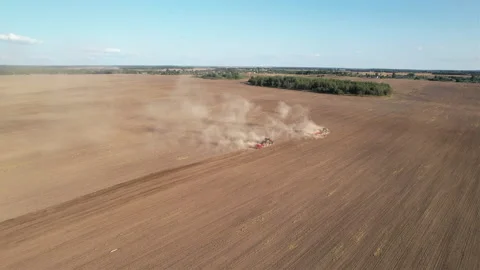 Disk harrow on plowing field. Soil cultivation field use tractor. Stock-Footage 212575155
