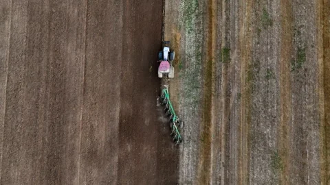 Disk harrow on plowing field. Soil cultivation field use tractor. Stock-Footage 213285077