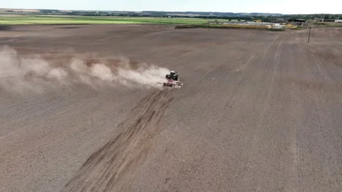 Disk harrow on plowing field. Soil cultivation field use tractor. Stock Footage 224306882
