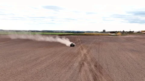 Disk harrow on plowing field. Soil cultivation field use tractor. Stock Footage 224306948