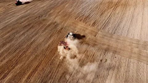 Disk harrow on plowing field. Soil cultivation field use tractor. Stock Footage 224313620