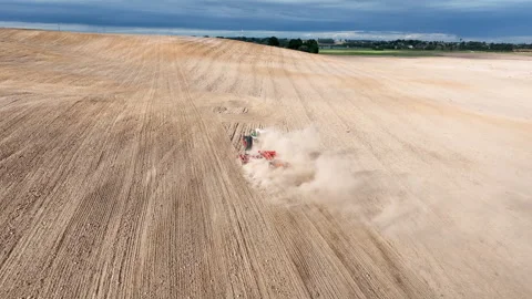Disk harrow on plowing field. Soil cultivation field use tractor. Stock Footage 224313814