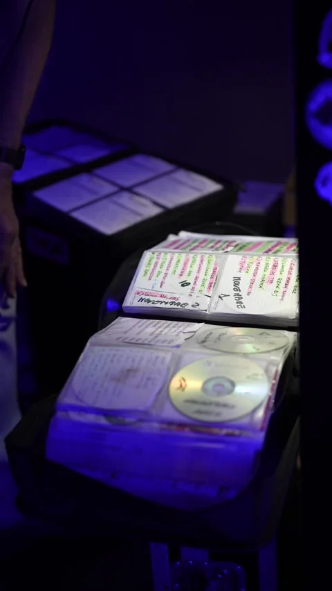 Disk jockey searching for the perfect cd Stock-Footage 333562875