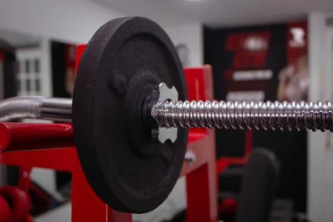 Disk weight machine in a gym to do arm training with weight Stock Photos