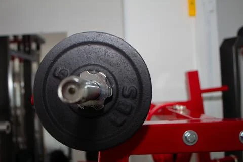 Disk weight machine in a gym to do arm training with weight Stock Photos