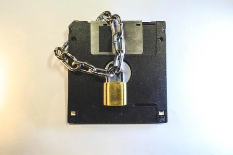 The diskette is protected by a lock with a chain. Фото