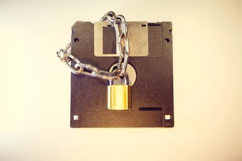 The diskette is protected by a lock with a chain. 스톡 사진