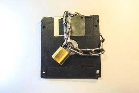 The diskette is protected by a lock with a chain. Фото