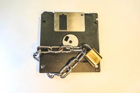 The diskette is protected by a lock with a chain. 스톡 사진