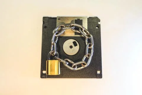 The diskette is protected by a lock with a chain. 스톡 사진
