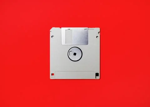Diskette on red Stock Photos
