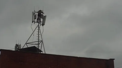 Dismantling of the antenna part of the cellular base station Stock Footage 80082378