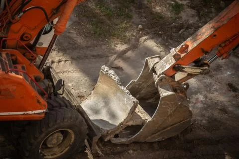 Dismantling of old concrete structures with an excavator. Stock Photos